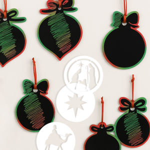 scatch art ornaments with scratch off showing the colors underneath, three white nativity themed stencils