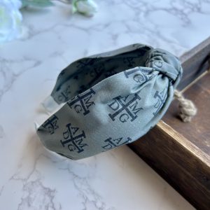 AMDG Headband on Gray Background