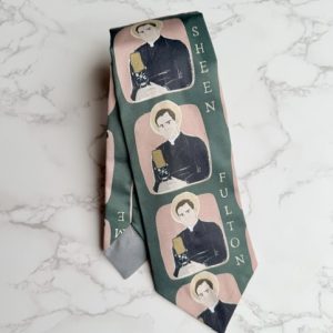 Necktie with image of Fulton Sheen speaking into a microphone on dark green background.